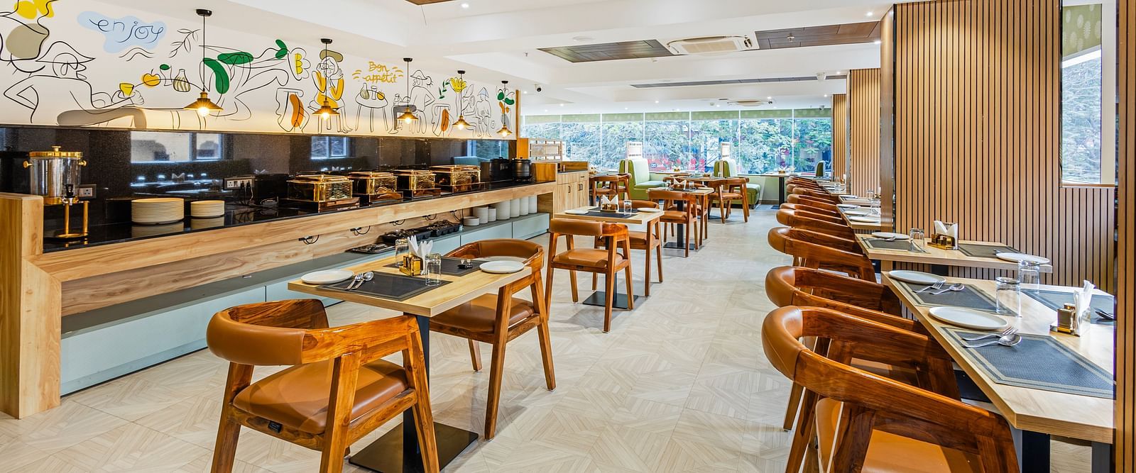 Lemonridge Hotels, KPHB | Dining area with tables and chairs, featuring a central ceiling design element. Modern lighting.